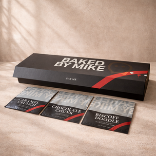 Custom cookie packaging design for Baked by Mike featuring premium black box and individual cookie bags with bold branding and flavor labels