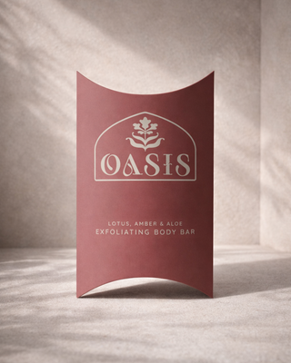 Custom printed pillow box packaging for Oasis Lotus, Amber & Aloe exfoliating body bar premium cosmetic and skincare product packaging design.