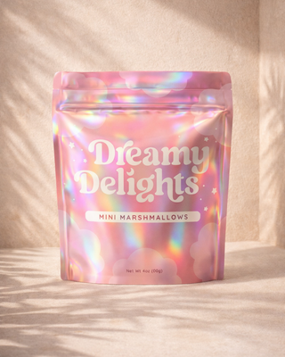 Holographic stand-up pouch packaging for Dreamy Delights mini marshmallows, featuring custom printed mylar bag design with resealable zipper for premium food and snack packaging.